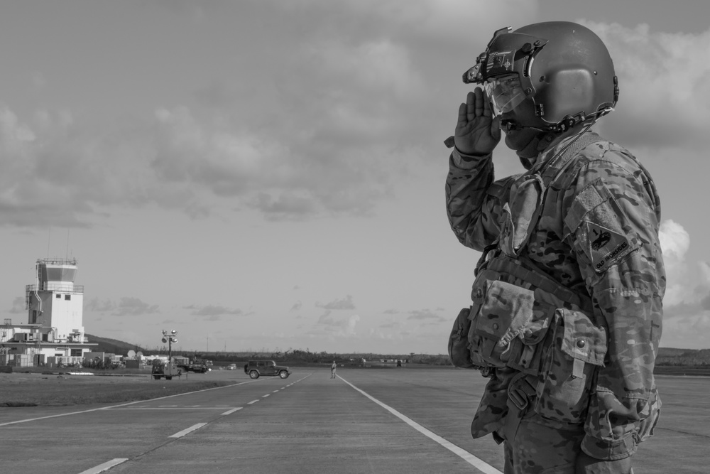 Soldier salutes at airfield