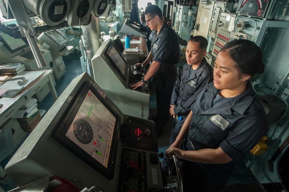 USS America Sailor steers helm