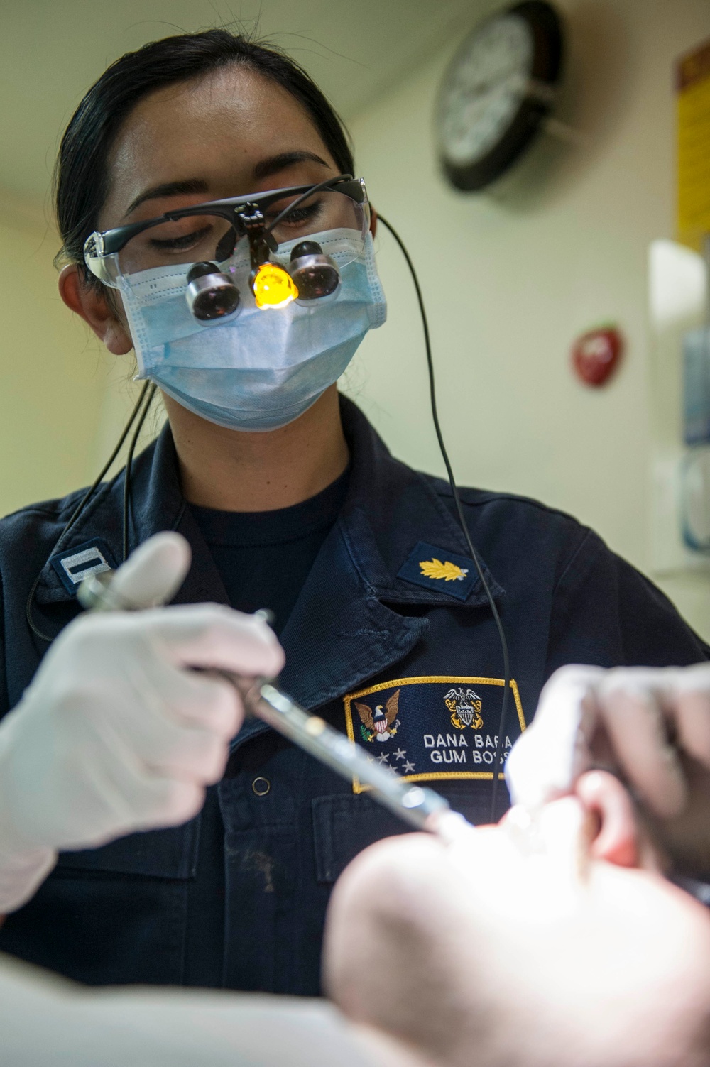 USS America Sailor performs tooth filling