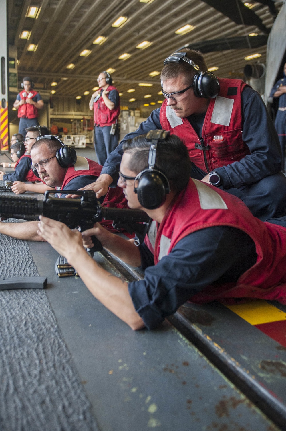 USS America Sailors participate in live fire exercise