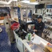 USS America Sailor sells products at ship’s store