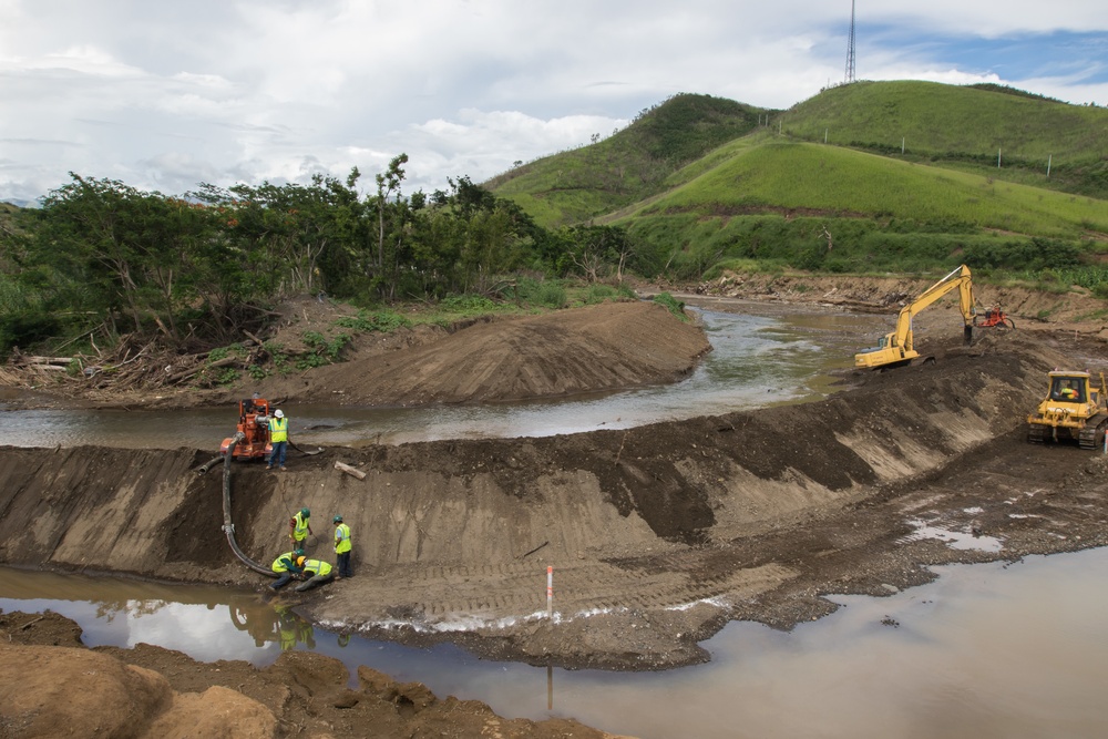 Workers and Earthmoving Machines Build Emergency Levee, Puerto Rico