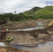 Workers and Earthmoving Machines Build Emergency Levee, Puerto Rico