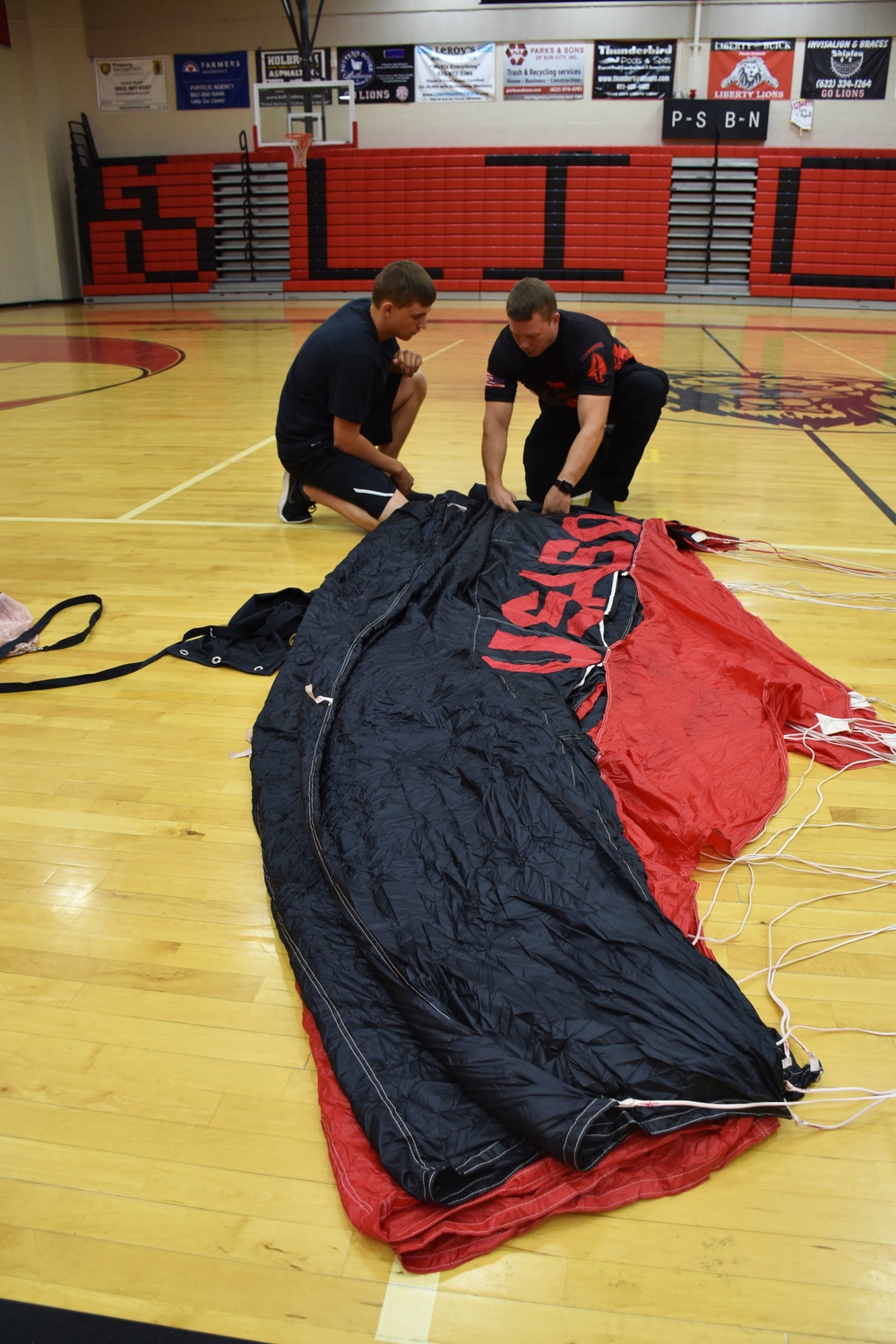 Black Daggers parachute team visits Phoenix area high school