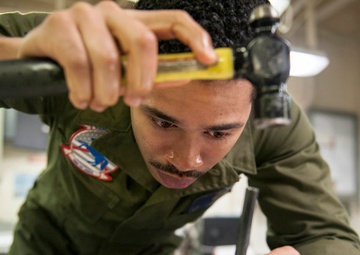 15th MEU Marine pens pin on actuator rod piston