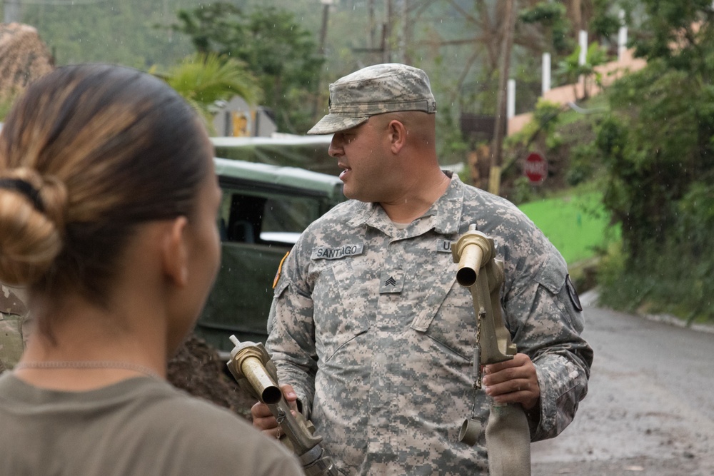 Soldiers supply purified water to Naranjito