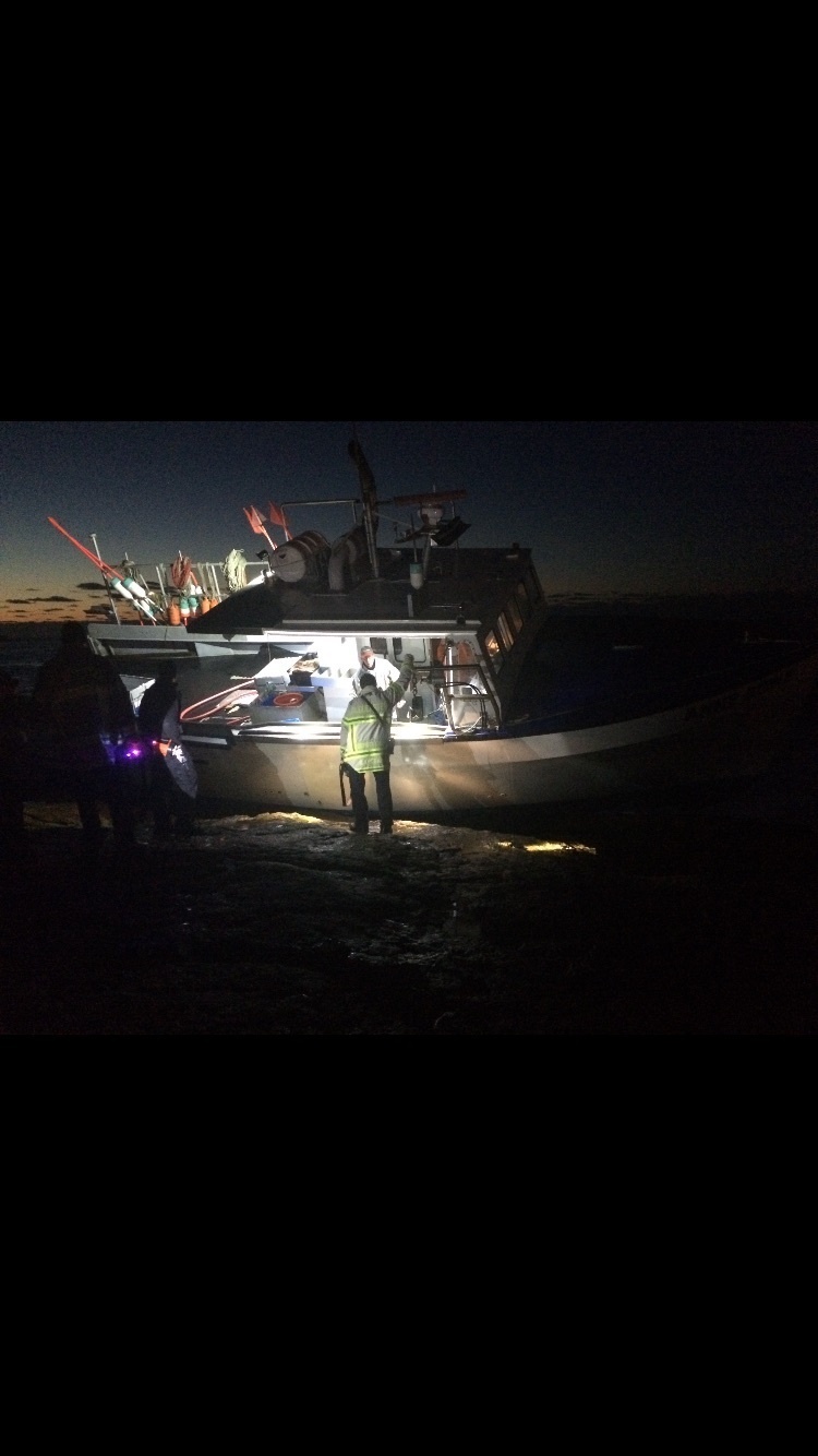 Coast Guard, fire department rescue 3 fishermen from grounded fishing vessel off Gloucester