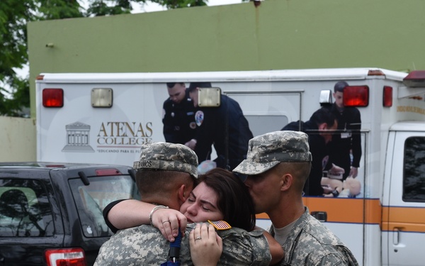 Former students distribute food and water at their local high school