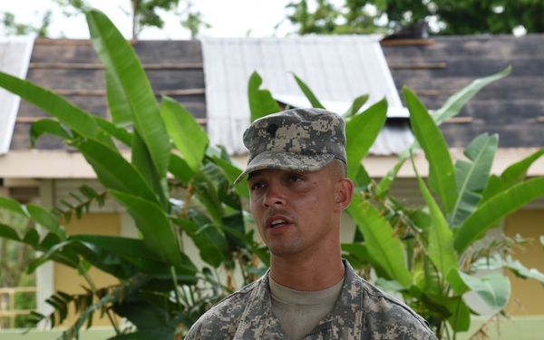 Former students distribute food and water at their local high school