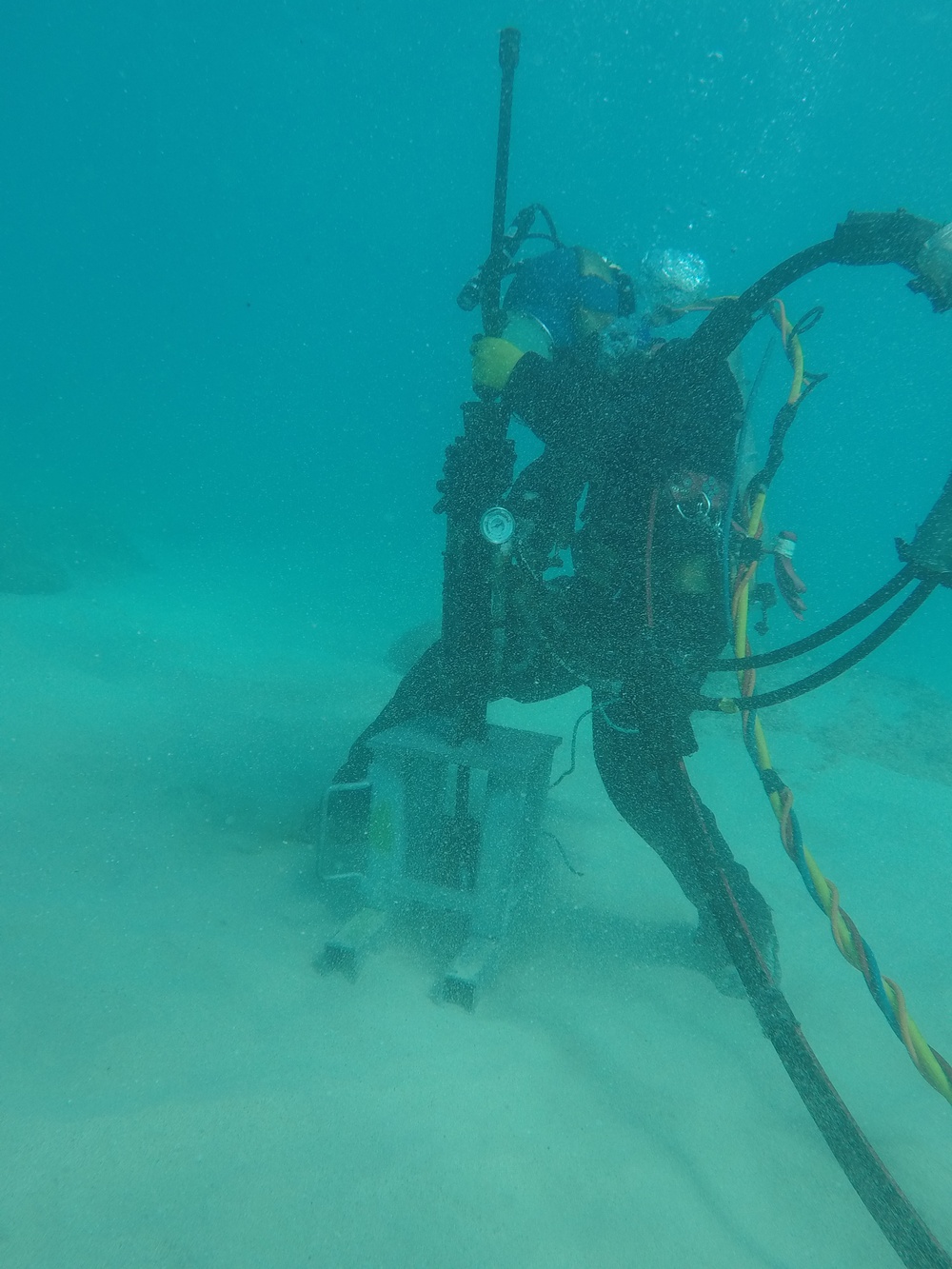 Divers install mooring anchors off Kaimana beach for Pacific Paradise