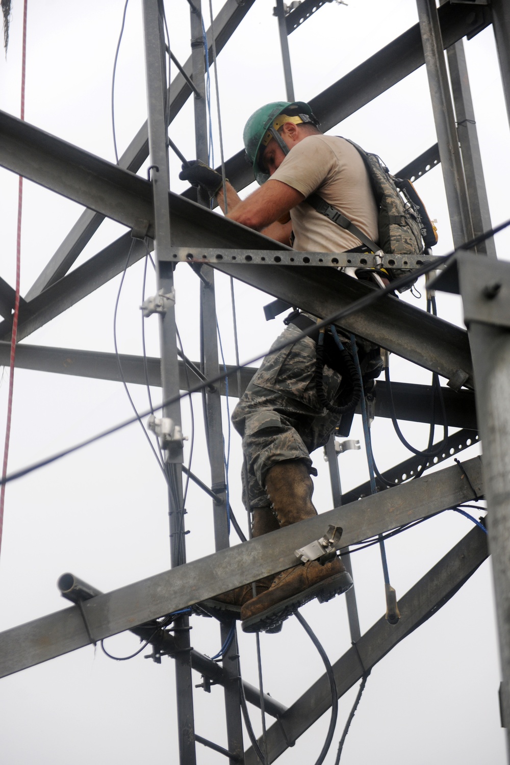 USAF Engineer descends communication tower