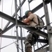 USAF Engineer descends communication tower