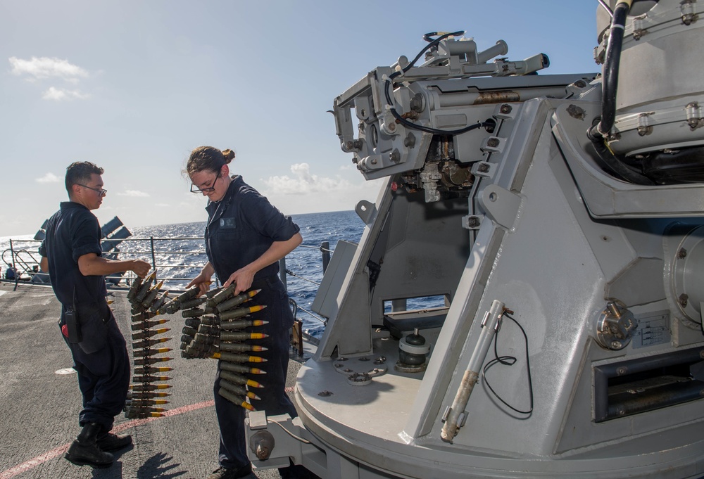 Sailors load Mark 38 25 mm machine gun