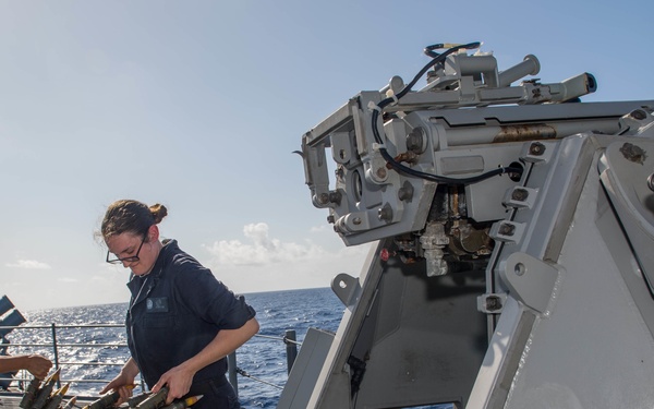 Sailors load Mark 38 25 mm machine gun