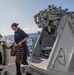 Sailors load Mark 38 25 mm machine gun