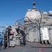 Sailors conduct maintenance on Mark 38 25 mm machine gun