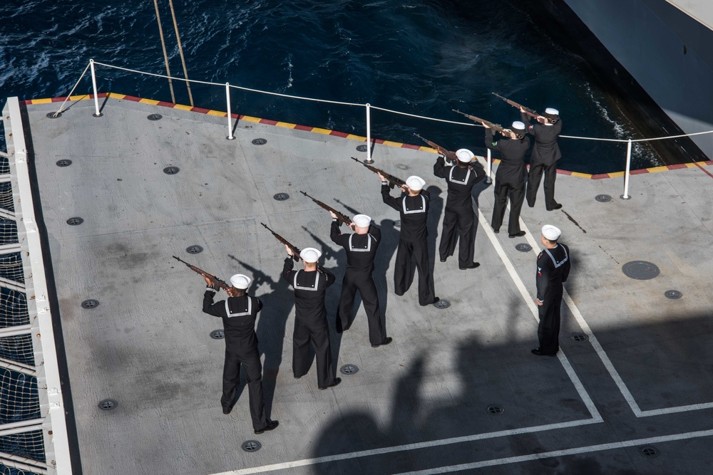 Sailors perform a burial at sea.