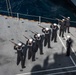 Sailors perform a burial at sea.