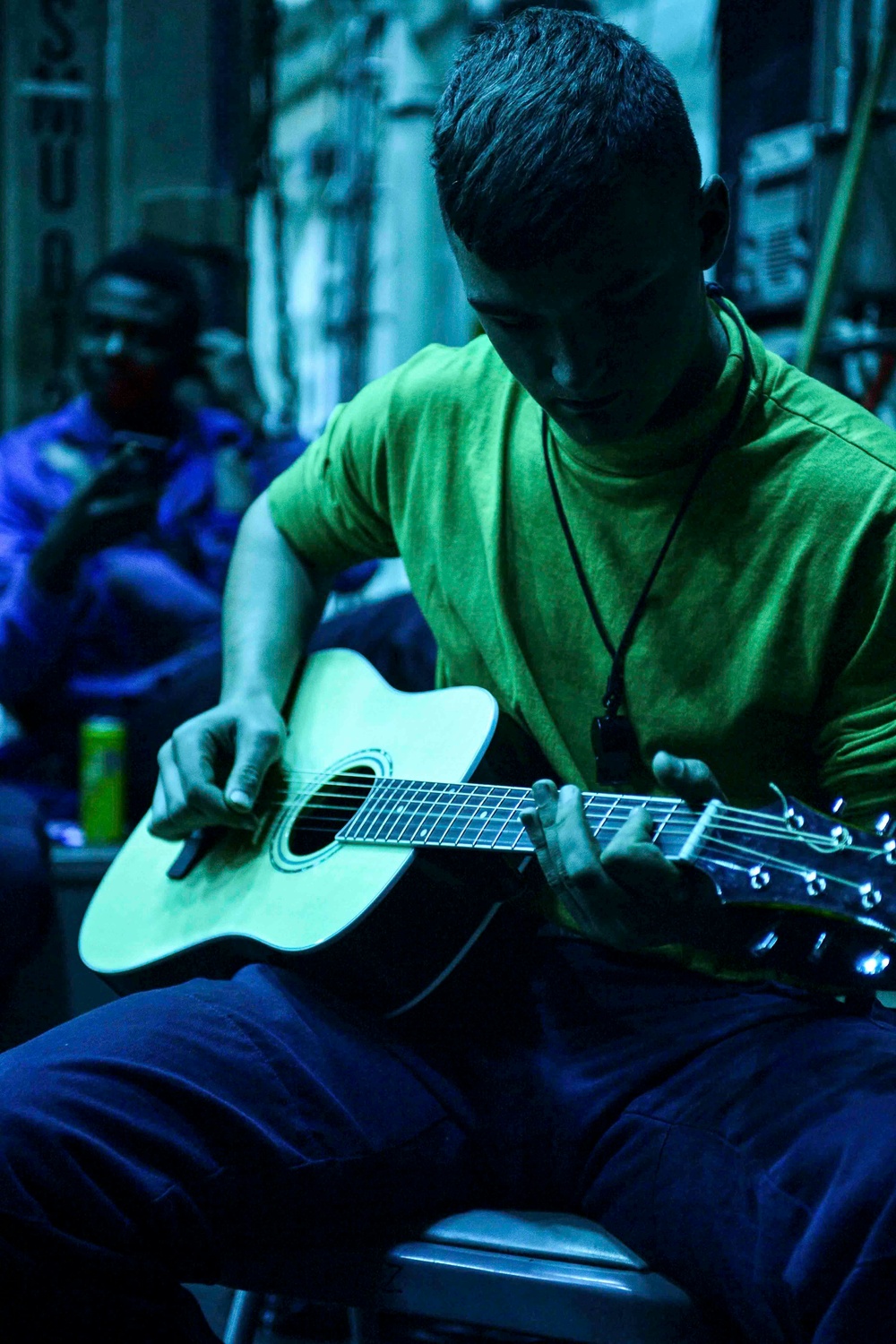 USS San Diego (LPD 22) Airman Plays Guitar