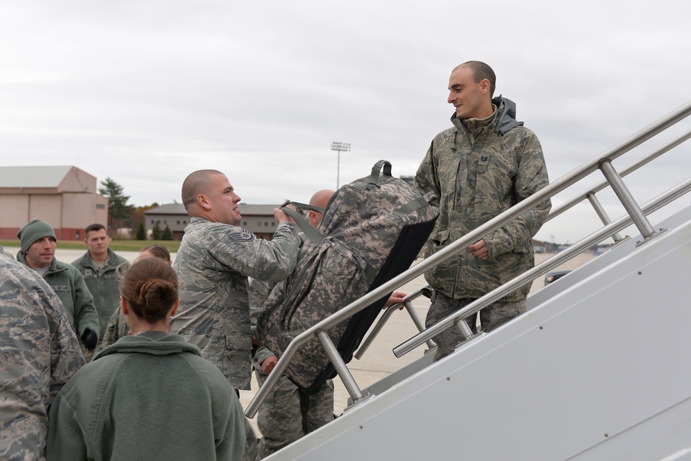 260th ATCS Airmen load gear before deployment to Puerto Rico