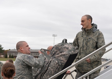 260th ATCS Airmen load gear before deployment to Puerto Rico