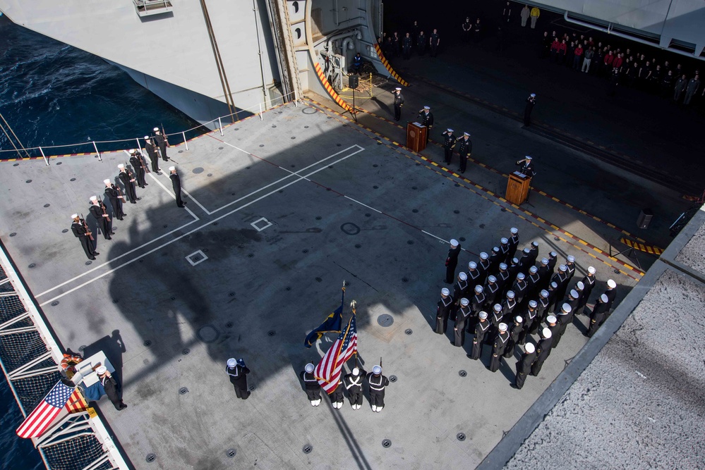 Sailors perform a burial at sea.