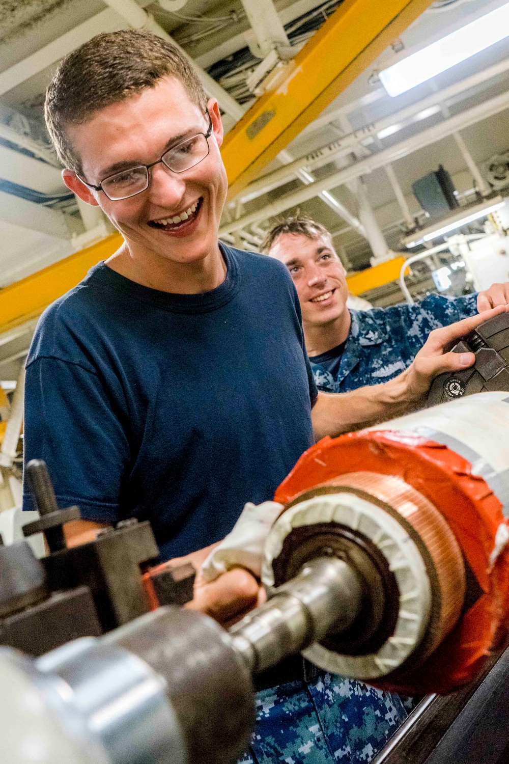 USS EMORY S. LAND Sailors build a priming pump for USS Michigan