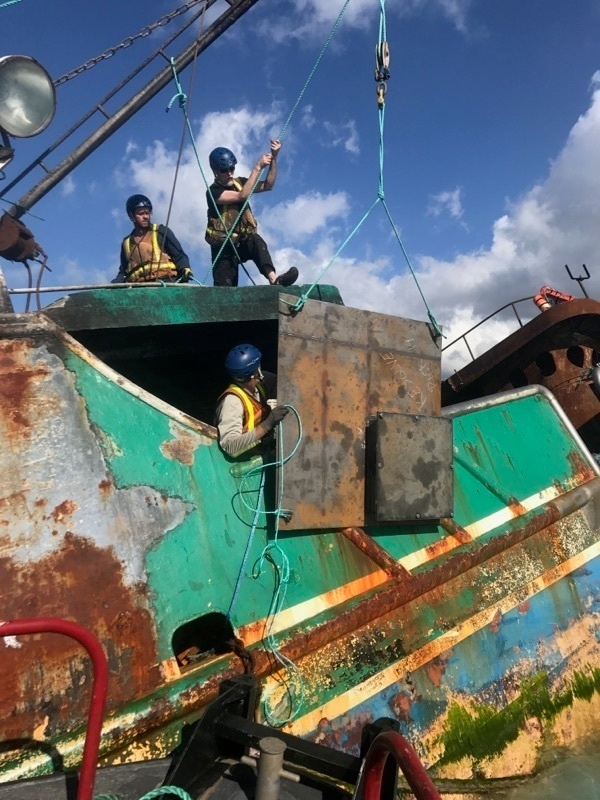 Loading salvage hatch onto Pacific Paradise