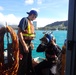 Responders prepare diver during Pacific Paradise wreck removal efforts