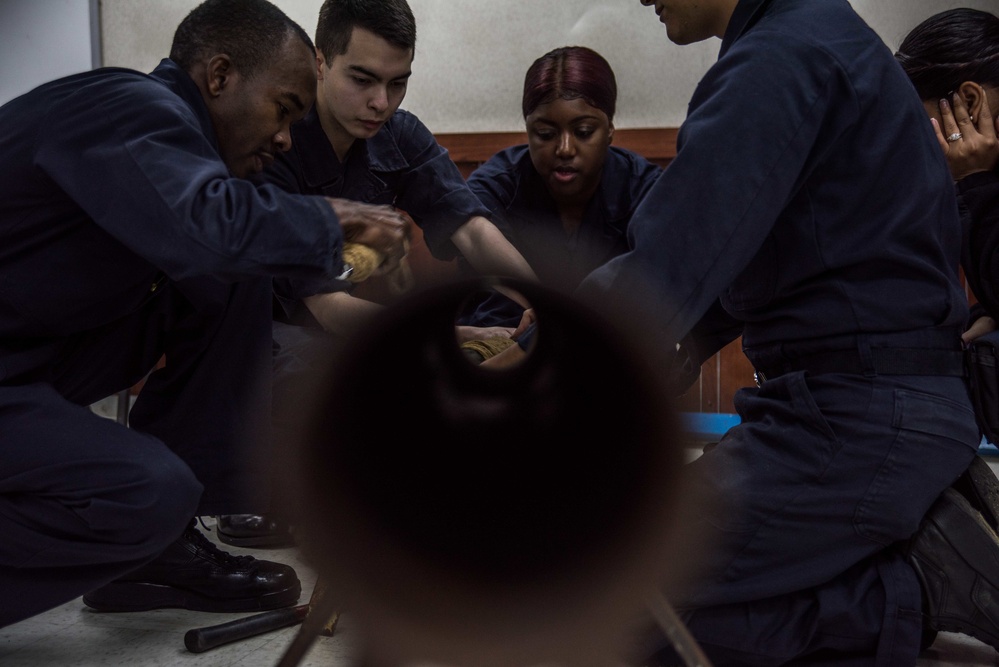 Sailors perform a soft patch.