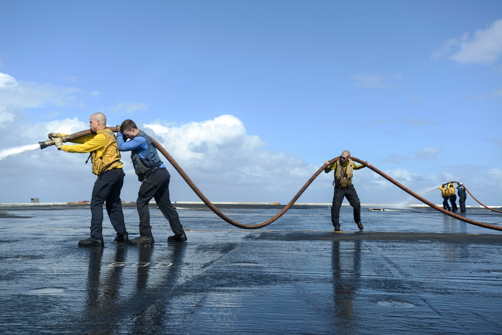 Nimitz Sailors Wash Down Flight Deck