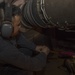 USS Lake Erie (CG 70) engineer cleans beneath generator