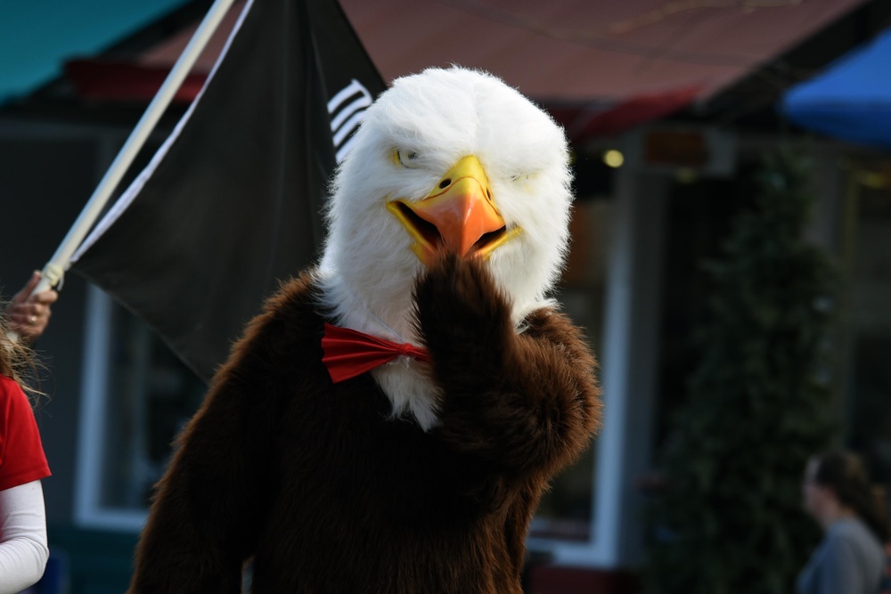 Flags flow, Opinicus stands tall during parade