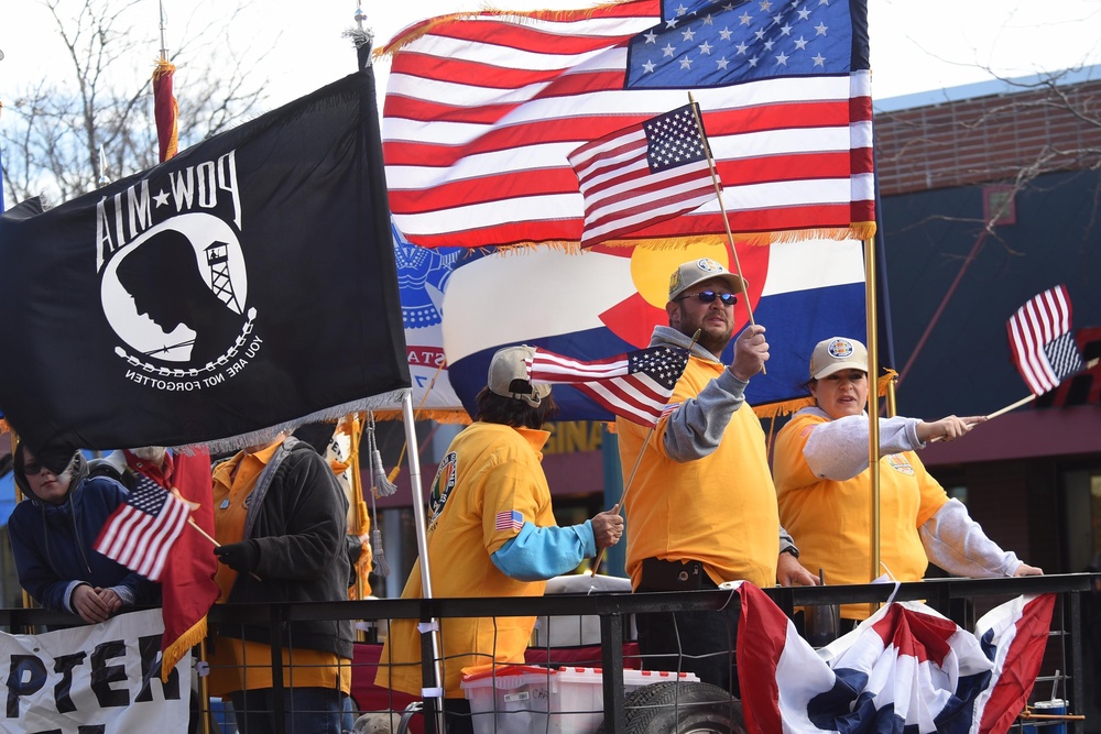 Flags flow, Opinicus stands tall during parade
