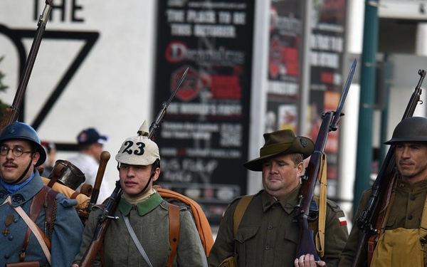 Flags flow, Opinicus stands tall during parade