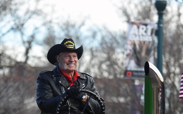 Flags flow, Opinicus stands tall during parade
