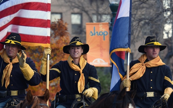 Flags flow, Opinicus stands tall during parade