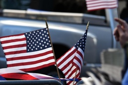 Flags flow, Opinicus stands tall during parade