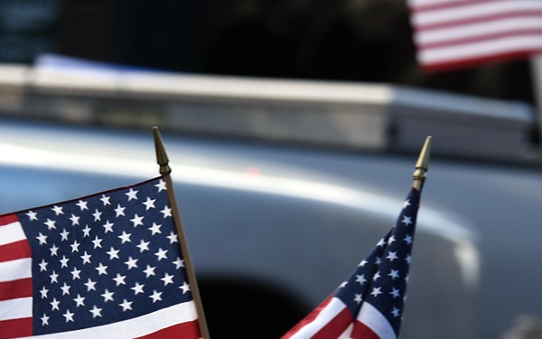 Flags flow, Opinicus stands tall during parade