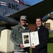 State Rep. Mehaffie presents citation to Airman, tours base
