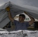 DMAT Personnel Installs Tent Roof