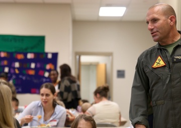 Families hold dinner for deployed spouses