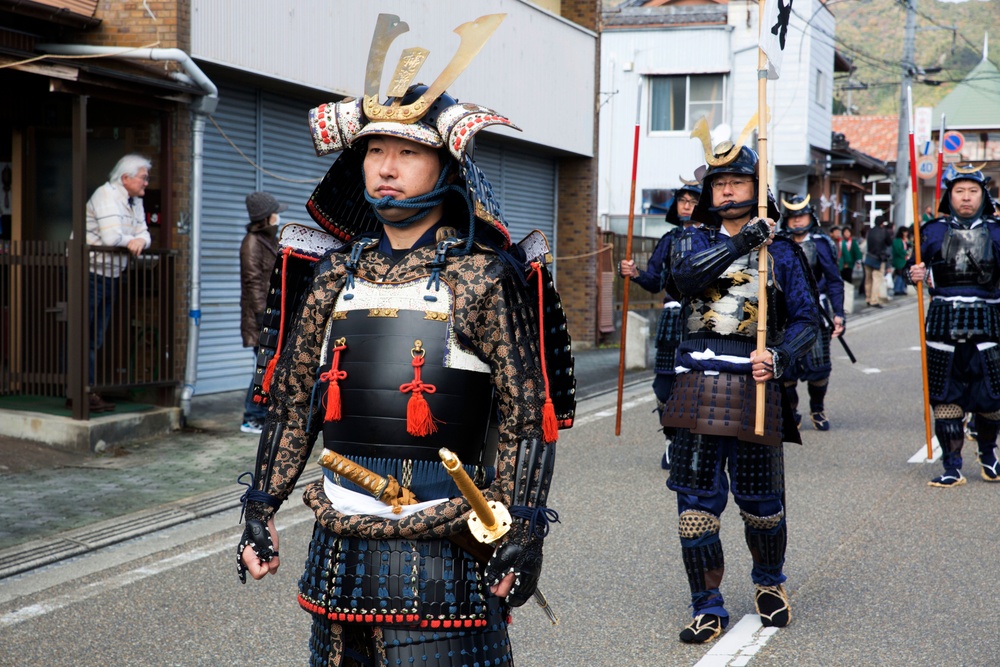 MCAS Iwakuni Marines march alongside locals during Kuragake Festival