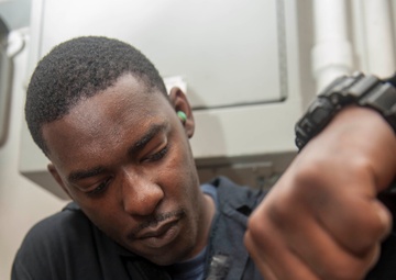 USS America Sailor assembles electronic disinfectant generator