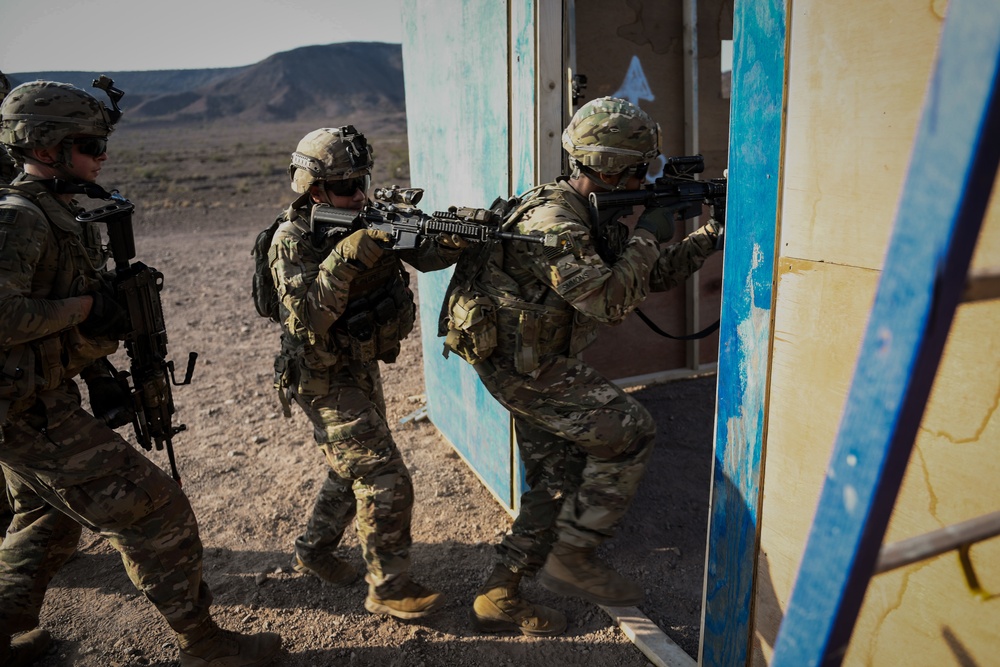 Soldiers conduct live fire shoot house training