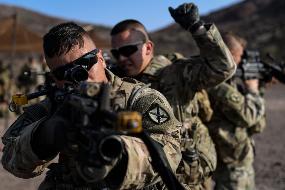 Soldiers conduct live fire shoot house training