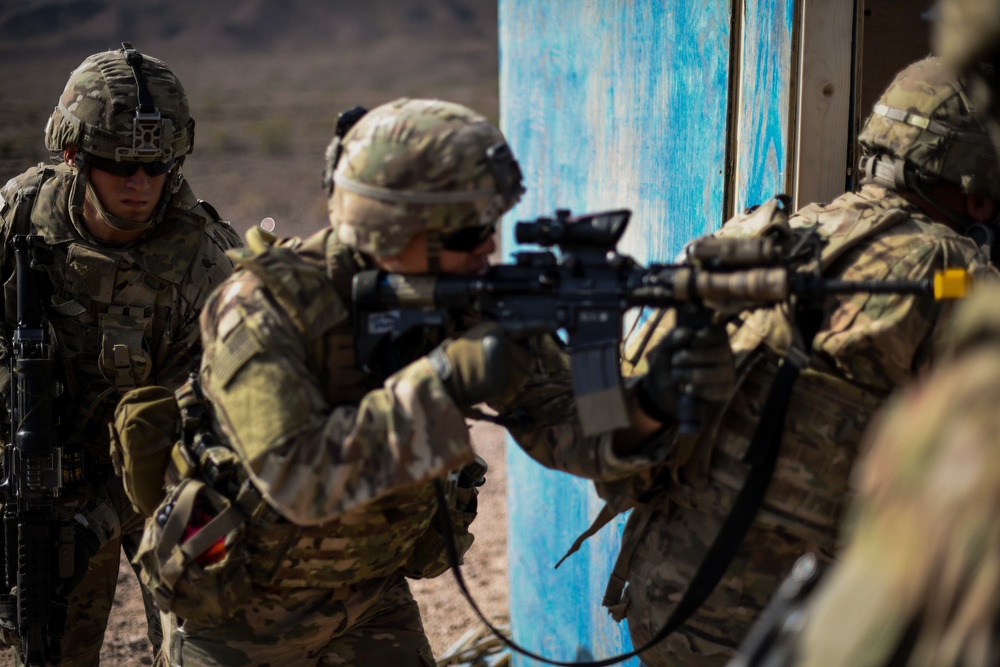 Soldiers conduct live fire shoot house training