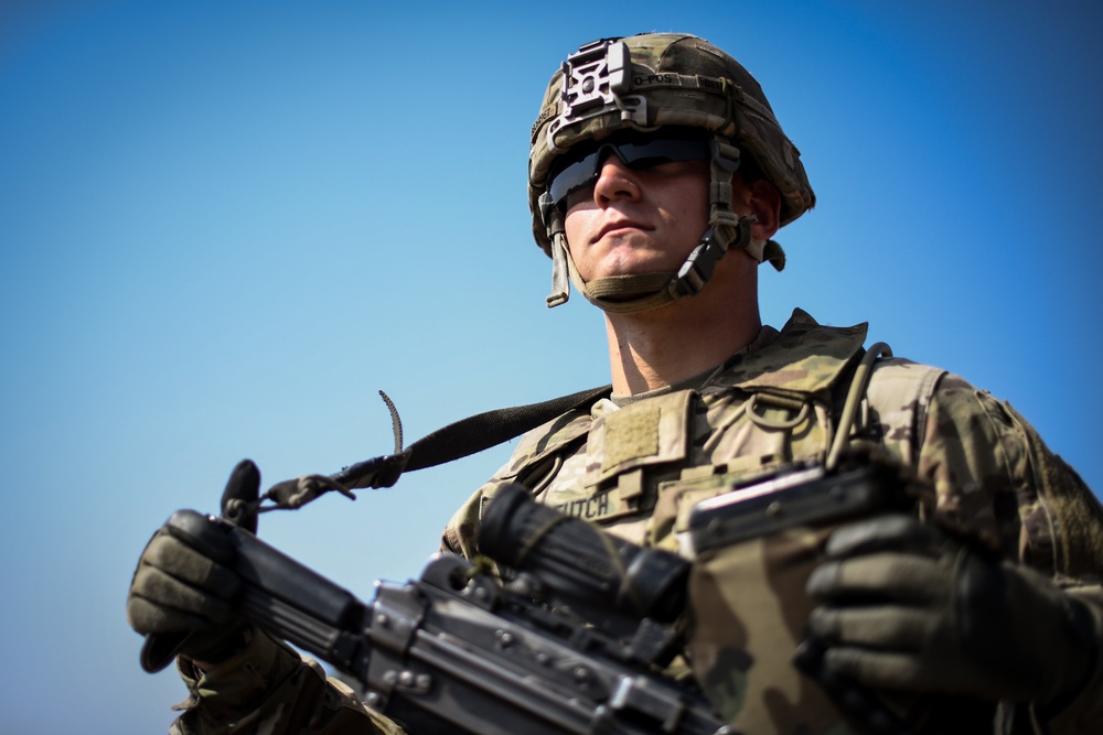 Soldiers conduct live fire shoot house training