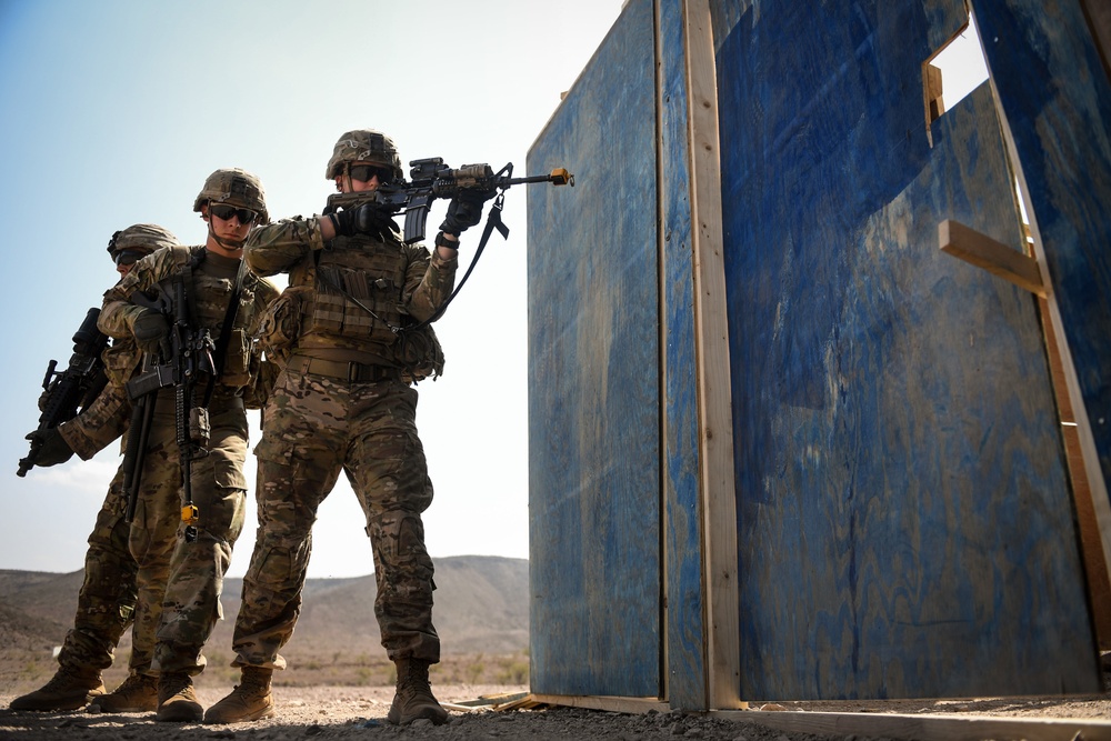 Soldiers conduct live fire shoot house training