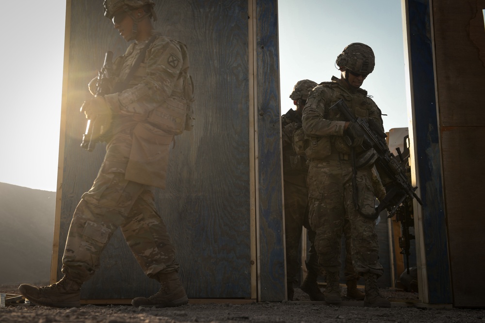 Soldiers conduct live fire shoot house training